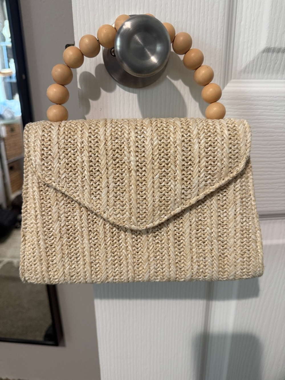 Small tan woven handbag